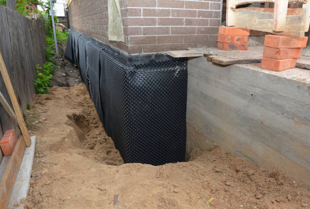 Happy homeowners after waterproofing job in Delafield